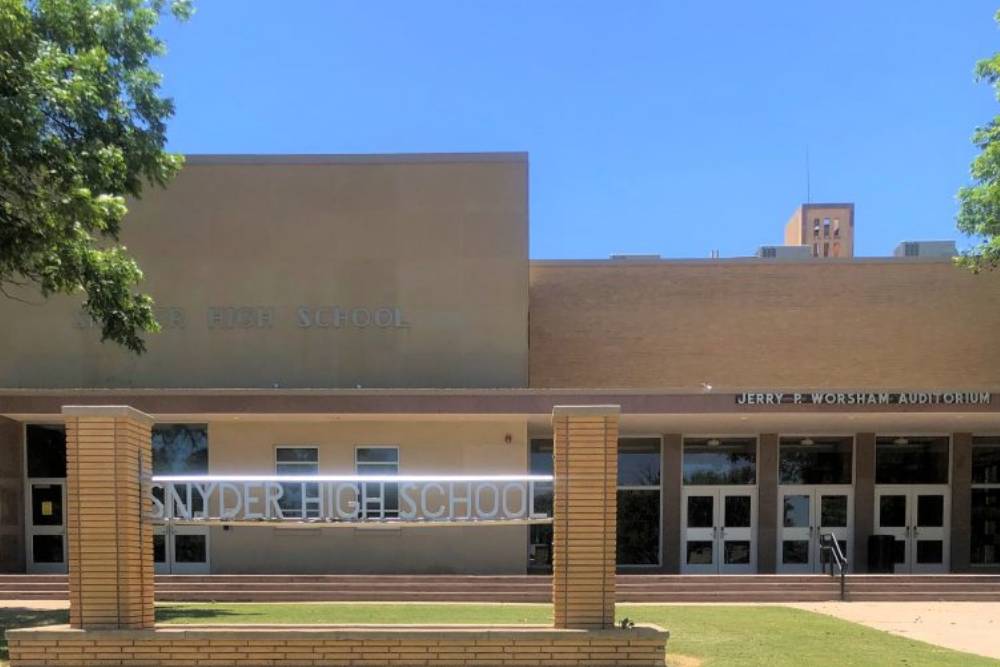 School Security System students outside school standing together